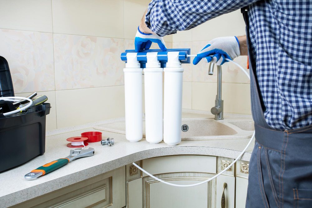 technician-installing-water-filter technician installing water filter